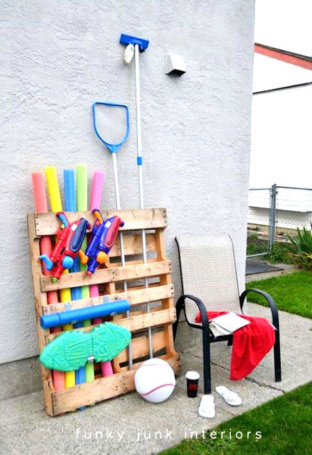 Wooden pallet used for storing pool accessories