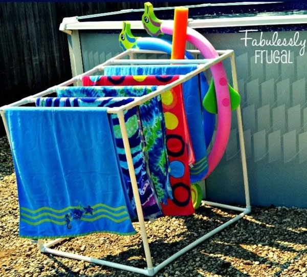 Towels and pool noodles on storage rack