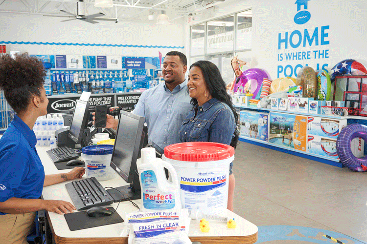 Leslie's associate with customers at the register