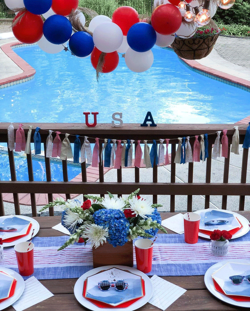 USA-themed decorations on table in front of pool