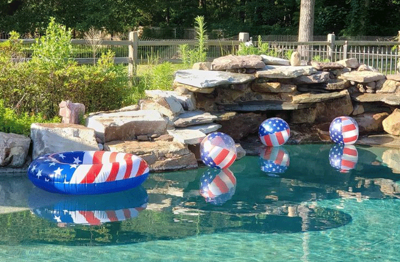 Red White and Blue tube and balls in pool